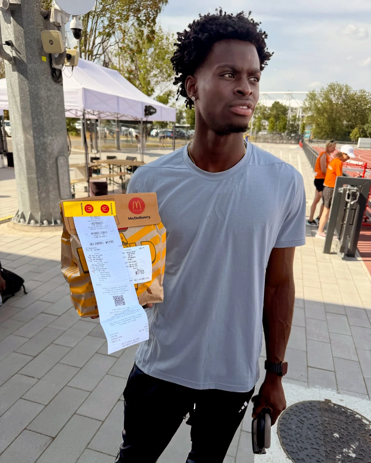 Ja’Kobe Tharp holds his McDonald's order Ja’Kobe Tharp holds his McDonald's order